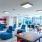 a room with blue chairs and tables