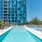 a swimming pool in front of a large building