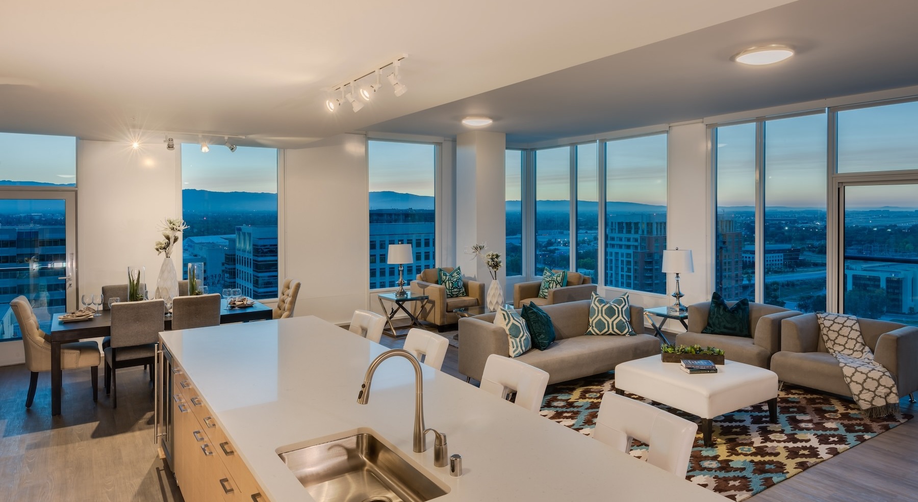kitchen and living area with wrap-around windows