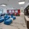 a room with large chairs and tvs