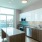 a kitchen with white cabinets